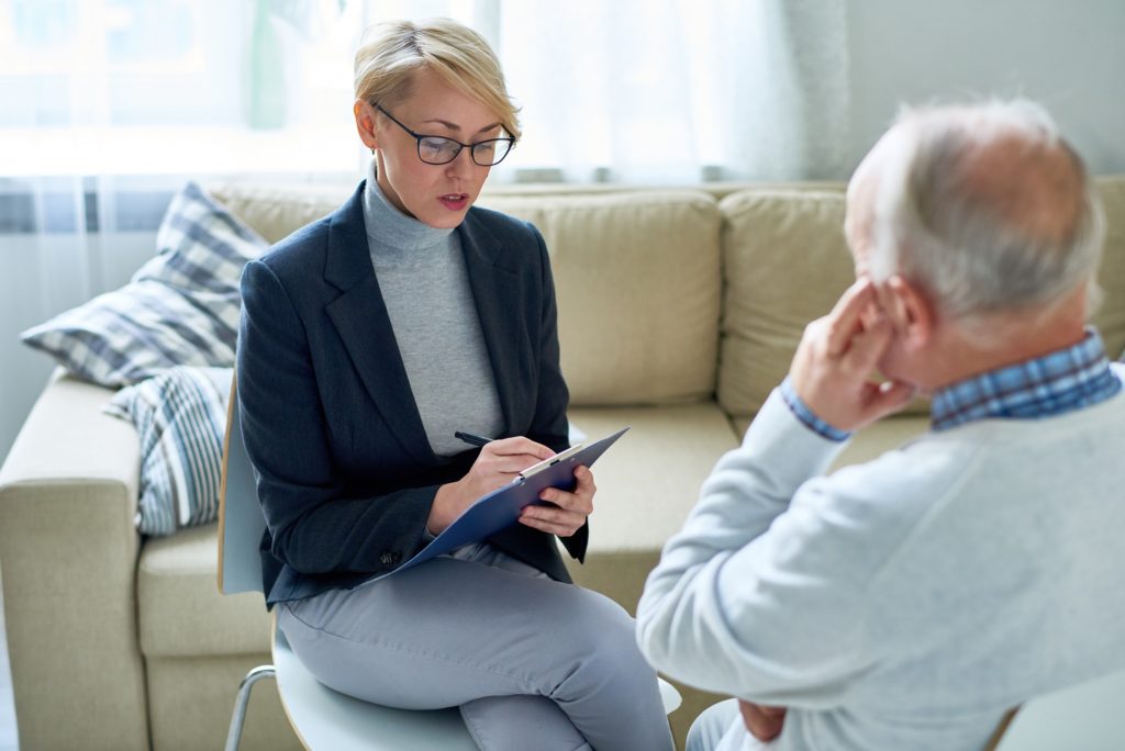 Female Psychologist Consulting Senior patient